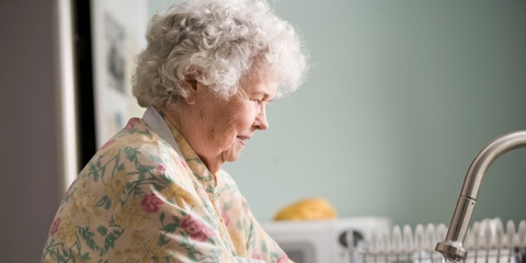 elderly woman washing hands